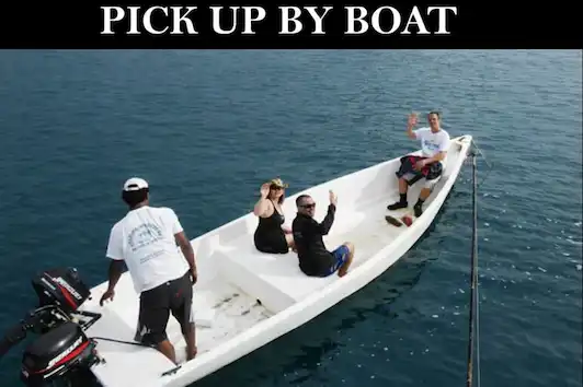 Pick up by boat from your resort beach using a dinghy